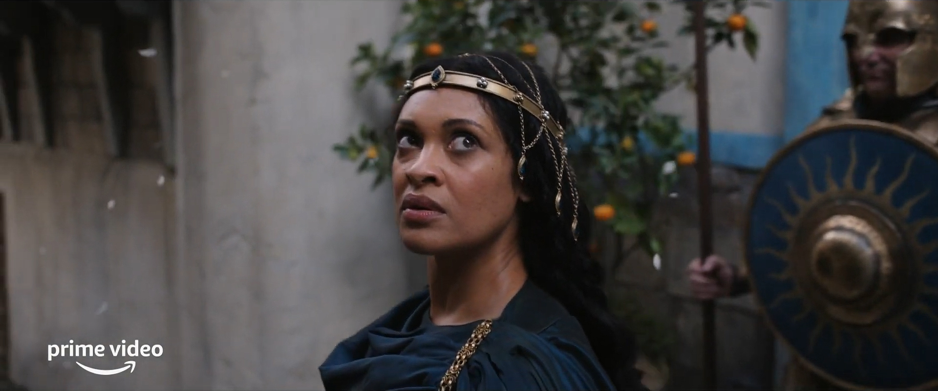 Queen Regent Miriel looking apprehensively over her shoulder