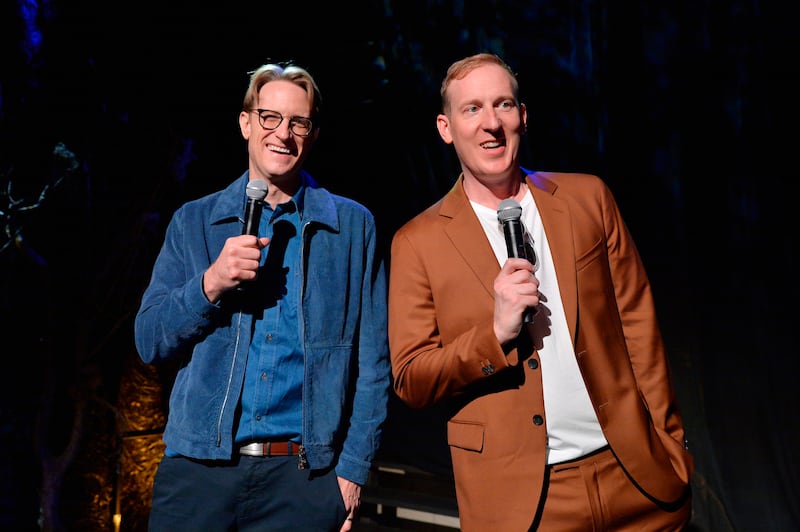 JD Payne and Patrick McKay standing, holding microphones