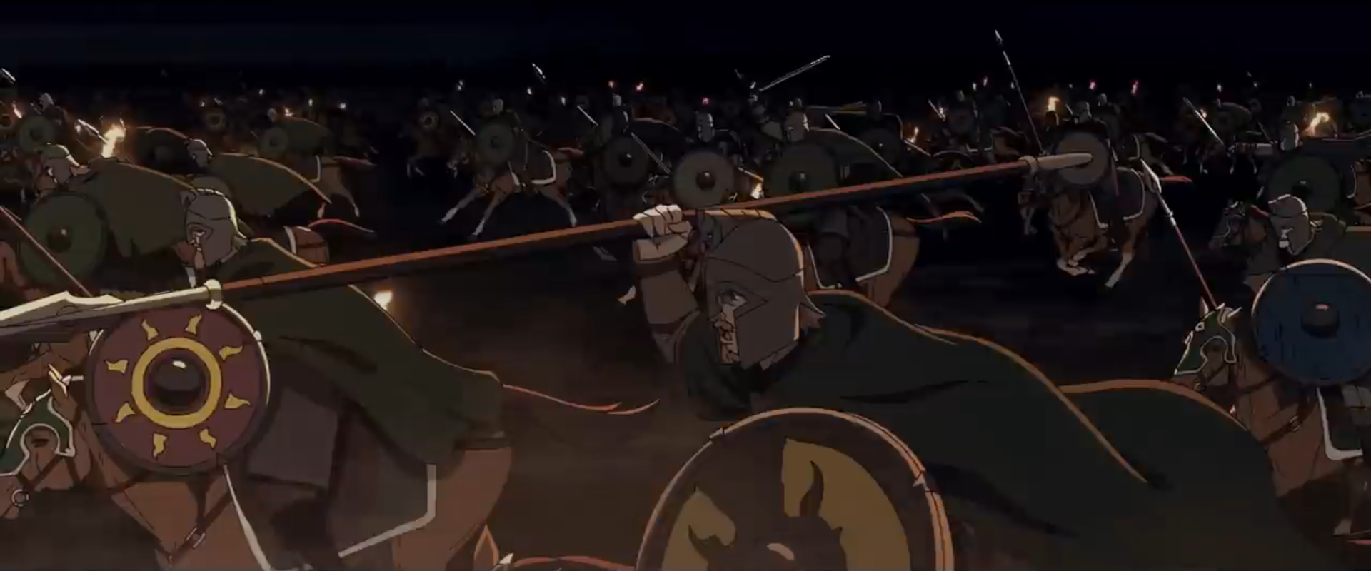 The Riders of Rohan charge downhill at their foes, brandishing swords and spears, in The War of the Rohirrim.