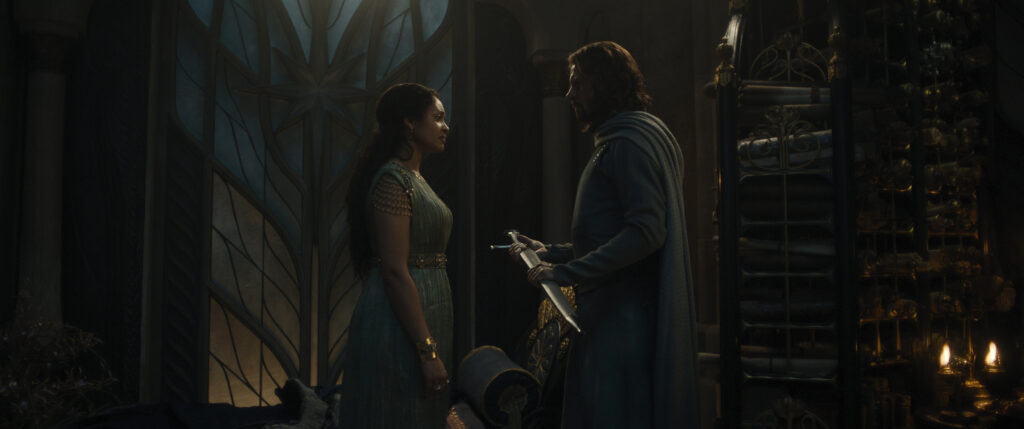 Queen Regent Míriel facing Elendil as he is holding and looking at a sheathed sword