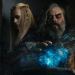 Composite image showing Sauron as Annatar, in profile, and Ar-Pharazôn with his hand on a Palantir while looking into it