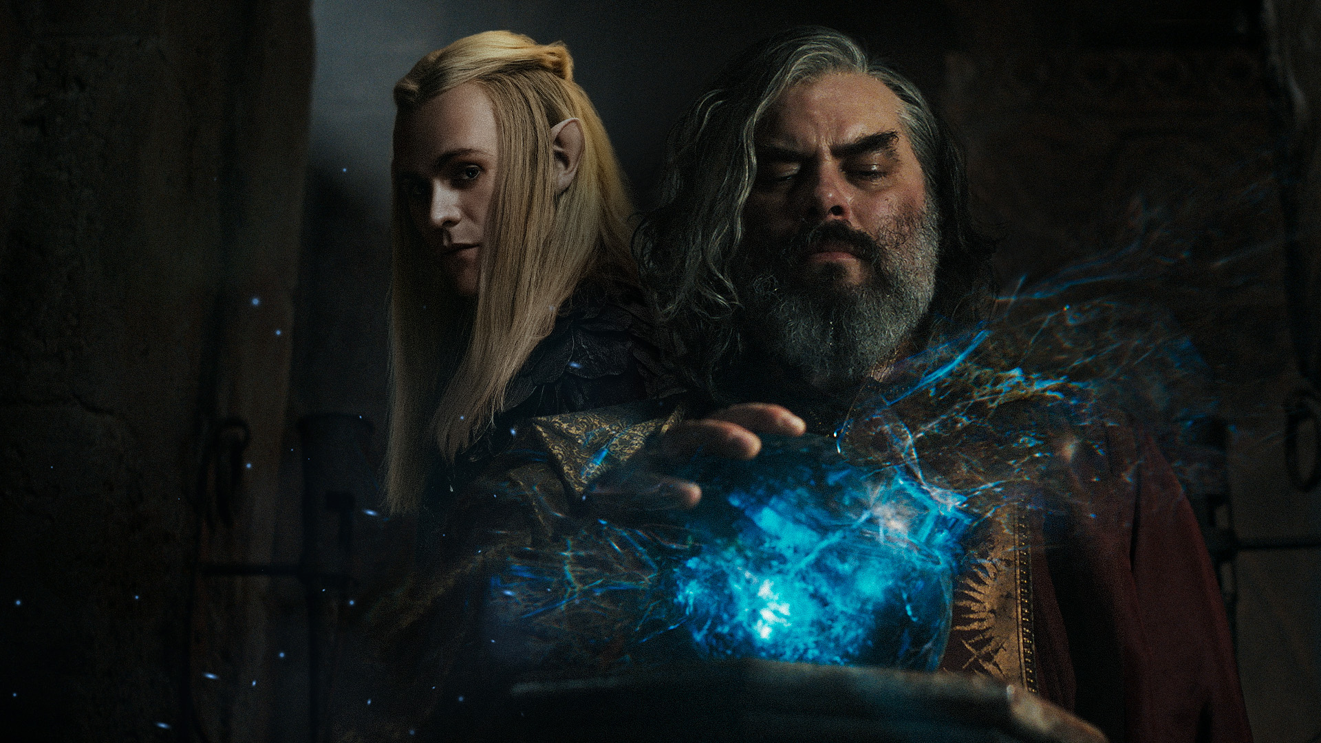 Composite image showing Sauron as Annatar, in profile, and Ar-Pharazôn with his hand on a Palantir while looking into it