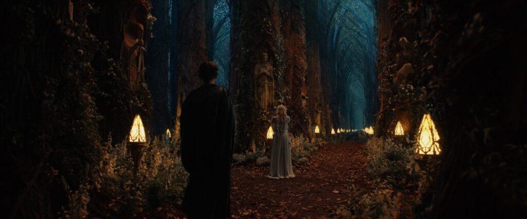 Galadriel stands under the figure of Finrod in the Grove of Remembrance