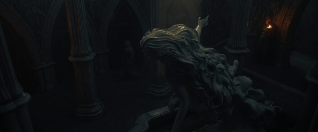 A statue of Uinen faces Sauron's prison cell