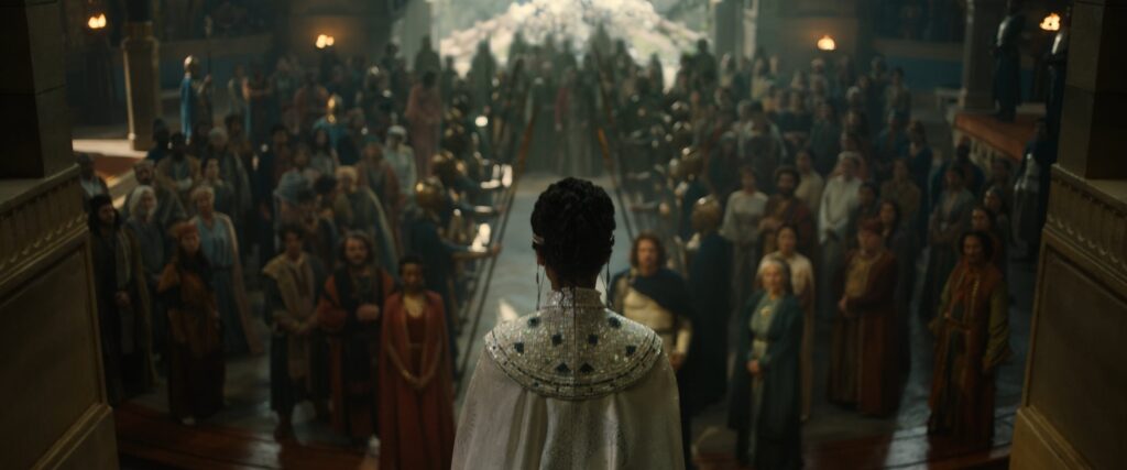 Míriel stands over a crowd at her coronation