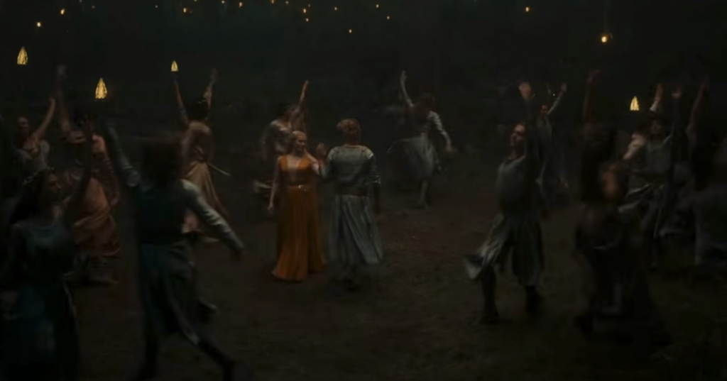 Celeborn and Galadriel taking part in a formal dance in a forest amongst a group Elves doing likewise