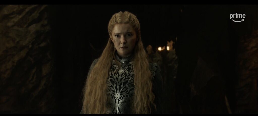 Galadriel in armour with her hair down, looking shocked