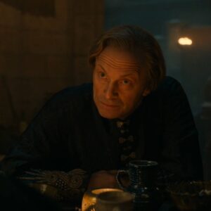 Will Keen as Lord Belzagar in Rings of Power, looking conspiratorial