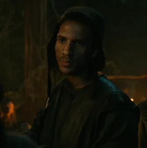 Gabriel Akuwudike as Hagen in Rings of Power, in a dimly-lit night scene