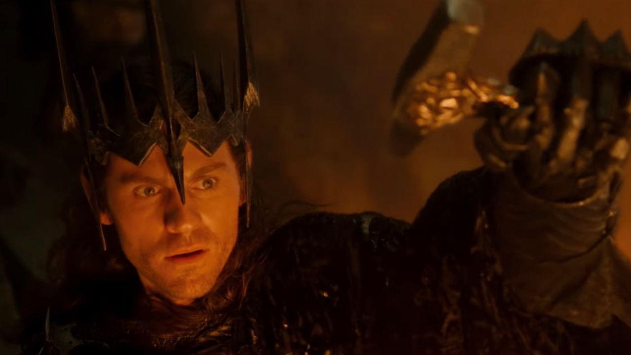 Sauron, wearing Morgoth's crown, in Sammath Naur and holding up Fëanor's hammer