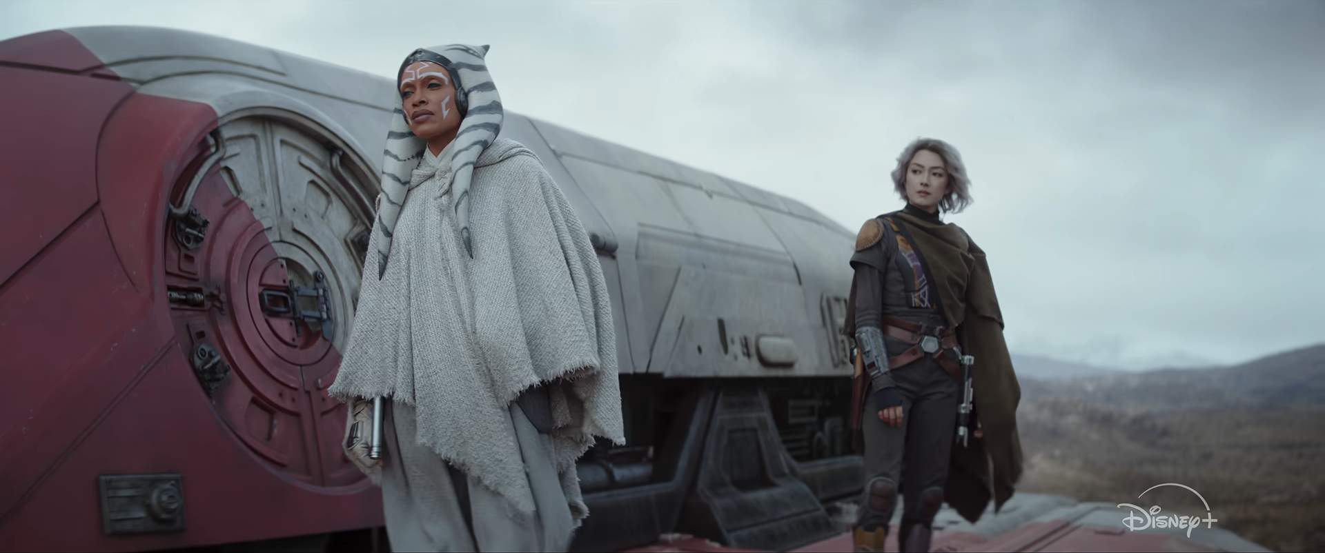 Ahsoka and Sabine next to a spaceship on a desolate landscape