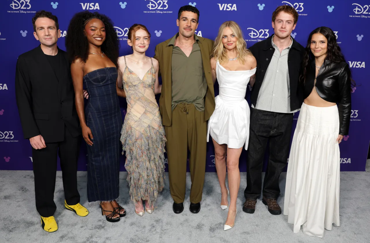 Cast of actors in front of a Disney D23 backdrop. Credit: Deadline