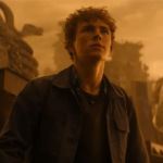 Percy Jackson looking up with apprehension at something out of shot. Credit: Disney