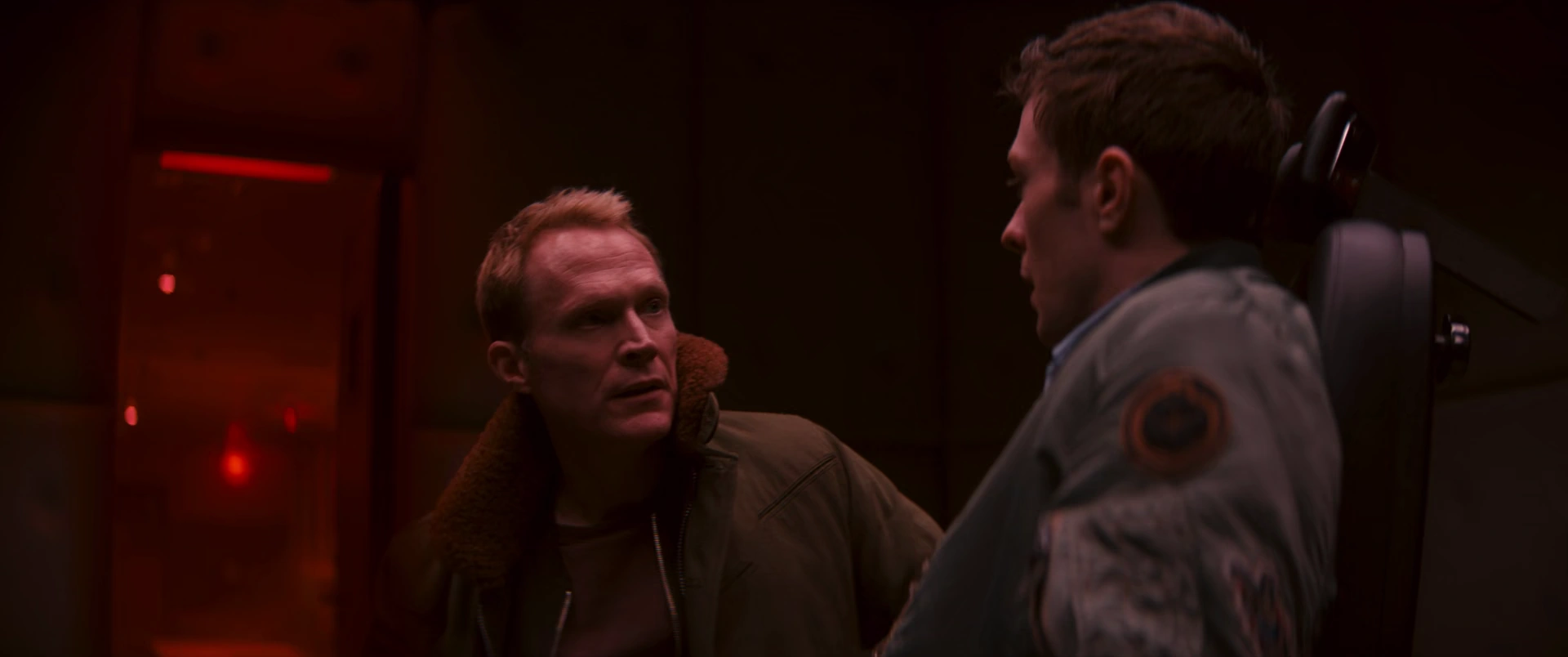 Vision and Tommy in a darkened scene